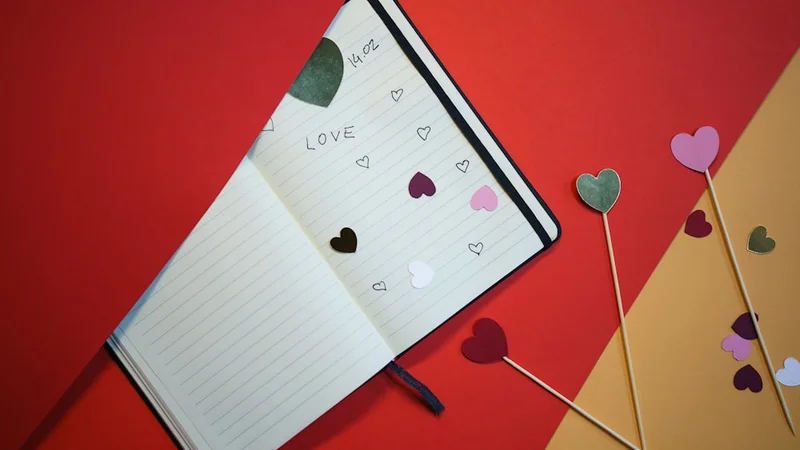 open notebook with handwritten questions and reflections, soft focus, pen resting beside it